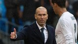 Zinédine Zidane reaches out a hand for Raphaël Varane as he comes off the pitch