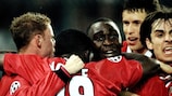United players mob Andrew Cole after his 1999 winner at Juventus
