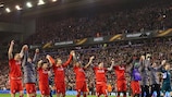 Liverpool salute the Kop after a famous win