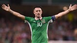 Robbie Keane celebrates after scoring against Oman