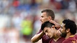 Roma's Diego Perotti is congratulated by Edin Džeko and Mohamed Salah