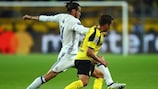 Gareth Bale tries to hold off Mario Götze during the sides' 2-2 draw on matchday two