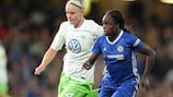 Nilla Fischer of Wolfsburg chases Eniola Aluko of Chelsea
