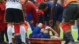 Andrés Iniesta lies injured on a stretcher after hurting his right knee against Valencia on Saturday