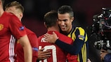 Wayne Rooney and Robin van Persie embrace at full time on matchday three
