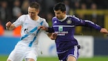 Vladimir Bystrov (left) and Behrang Safari vie for possession during the 2012/13 UEFA Champions League group stage