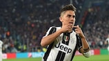 Paulo Dybala celebrates one of his two goals against Barcelona on Tuesday
