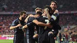 Cristiano Ronaldo is mobbed after scoring for Real Madrid at Bayern