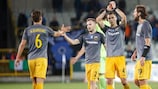 AEK celebrate a play-off win against Club Brugge
