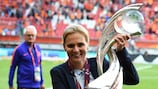 Netherlands coach Sarina Wiegman celebrates with the UEFA Women's EURO trophy