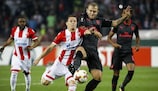 Arsenal midfielder Jack Wilshere challenges Crvena zvezda's Slavoljub Srnić during matchday three