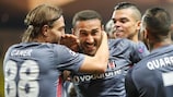 Cenk Tosun is congratulated by Ricardo Quaresma after scoring a group stage goal