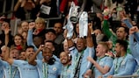 Manchester City captain Vincent Kompany lifts the English League Cup trophy