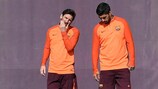 Lionel Messi and Luis Suárez share thoughts during training on Tuesday