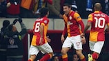 Burak Yilmaz (centre) celebrates scoring for Galatasaray against Schalke in 2013