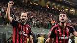 Milan's Gonzalo Higuaín (left) celebrates scoring against Olympiacos on matchday two
