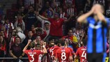 Antoine Griezmann is mobbed after scoring for Atlético against Club Brugge on matchday two