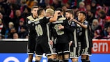 Noussair Mazraoui is mobbed after scoring Ajax's goal at Bayern