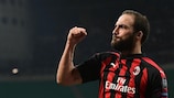 Gonzalo Higuaín celebrates scoring for Milan in his 100th UEFA club competition match