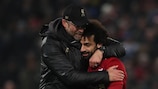 Mohamed Salah (right) celebrates reaching the round of 16 with Liverpool manager Jürgen Klopp
