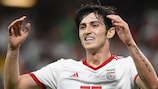 Sardar Azmoun in action with Iran: note the tattoo on his left arm