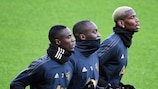 Paul Pogba (right) trained on Tuesday but is suspended for tonight's game