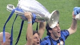 Javier Zanetti (centre) and Diego Milito (right) celebrate Inter's victory in Madrid last May