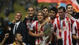 Atlético players celebrate winning their second European trophy in three months