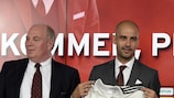 Josep Guardiola (centre) is introduced at a press conference as the new coach of Bayern