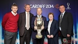 FAW chief executive Jonathan Ford holds the UEFA Super Cup trophy, flanked by (L–R) Ole Gunnar Solskjær, Welsh government minister John Griffiths, councillor Heather Joyce and Kevin Ratcliffe