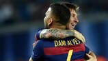 Lionel Messi celebrates his second goal with fellow record-breaker Dani Alves