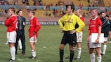 United players watch Lazio receive the trophy after the 1999 UEFA Super Cup