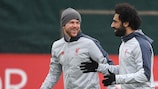 Mohamed Salah shares a joke with Alberto Moreno in training on Tuesday
