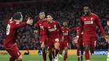 Divock Origi (far right) celebrates scoring Liverpool's clinching fourth goal