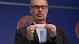 UEFA head of national team competitions Lance Kelly shows the name of Norway during the draw