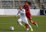 Belarus midfielder Maria Belobrovina in action against Serbian counterpart Ivana Trbojević