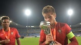 Captain Diogo Queirás kisses the trophy following Portugal's shoot-out victory over Spain