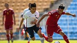 France right-back Alec Georgen tries to halt Belgium's Ismail Azzaoui from breaking away