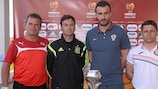 The Group A coaches pose with the UEFA European Under-17 Championship trophy