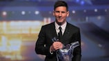 Lionel Messi shows off his 2014/15 UEFA Best Player in Europe Award