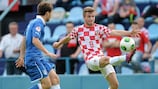 Croatia's Fran Brodić controls under pressure from Giacomo Sciacca