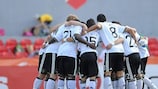 The Germany team in a huddle prior to their semi-final against Denmark