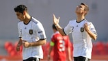 Kaan Ayhan of Germany (right) celebrates after scoring his side's first goal
