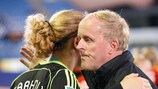 Germany coach Ralf Peter comforts Anna Sarholz after their 2-1 defeat by the US
