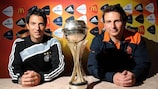 Germany coach Marco Pezzaiuoli (left) and the Netherlands' Albert Stuivenberg pose with the trophy in Magdeburg