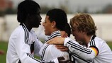 Shawn Parker is mobbed after scoring for Germany against FYR Macedonia