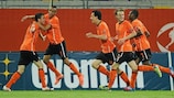 Rai Vloet (left) celebrates with his team-mates after scoring against Slovenia