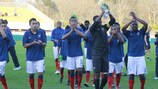 France celebrate their qualification at the end of March