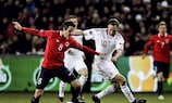 Henning Hauger looks to hold off Denmark goalscorer Dennis Rommedahl