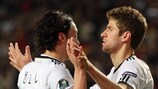 Thomas Müller (right) celebrates one of his two goals with Mesut Özil